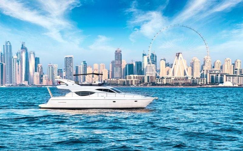 Luxury yacht cruising near Dubai Marina skyline